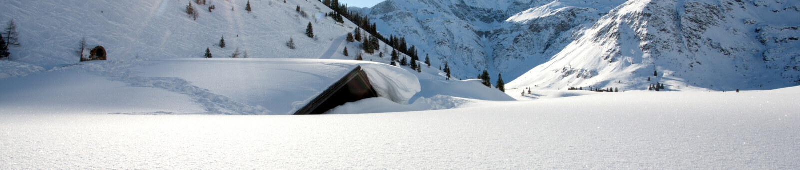     Winter landscape - snow-covered hut 